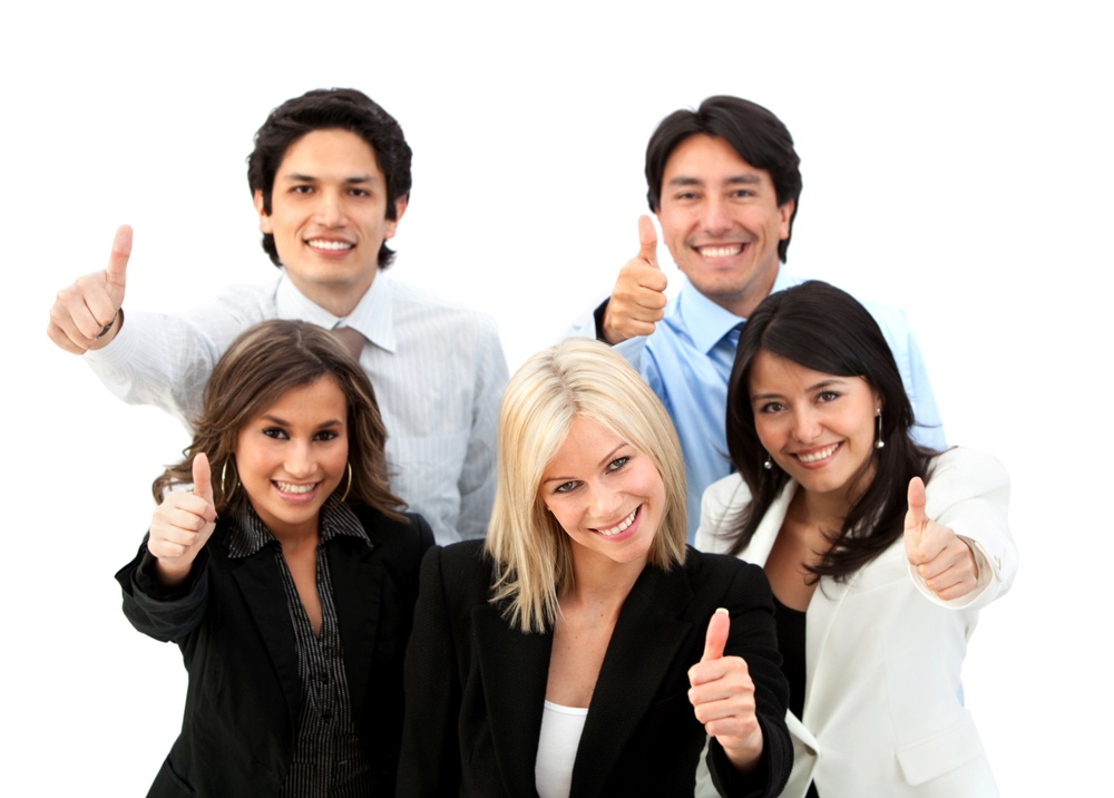 Successful business team with thumbs up - isolated over a white background